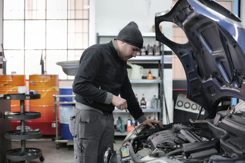An oil change in a repair shop.