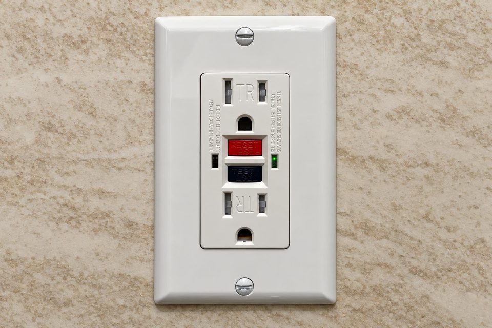 GFCI outlet installed on a wall.