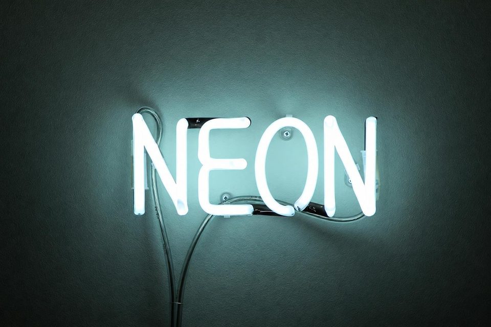 Neon sign tubes mounted on a wall.