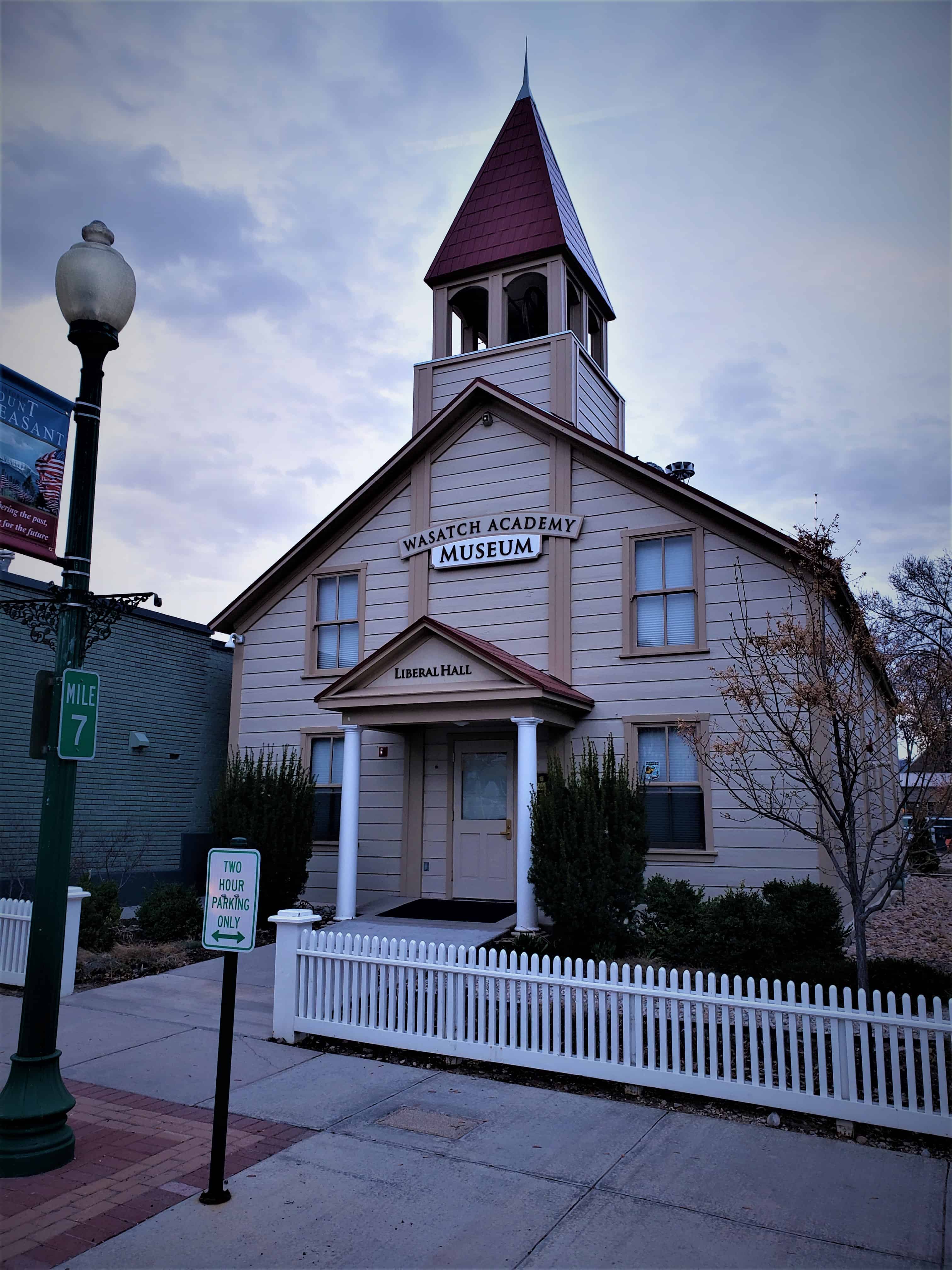 Liberal Hall, now the Wasatch Academy Museum, with its porch and Mile 7 sign