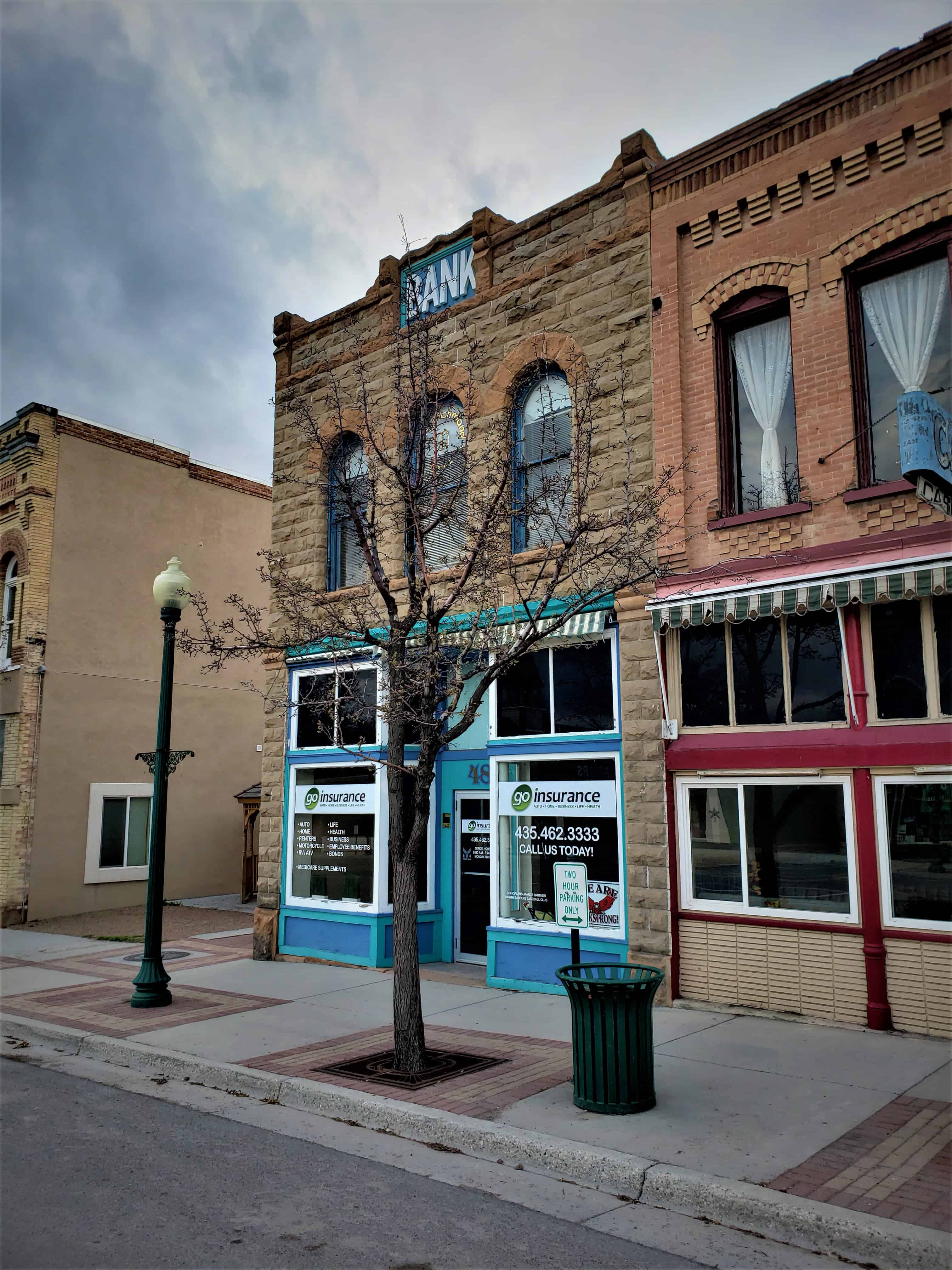 A vertical view of historic brick storefronts on Main Street